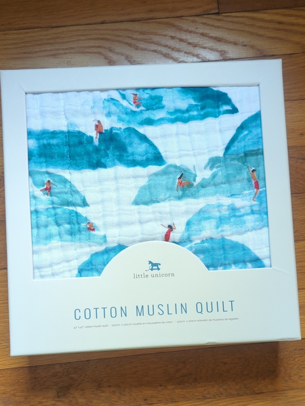 Little Unicorn Cotton Muslin Quilt - Blue & White Waves with Red Swimmers